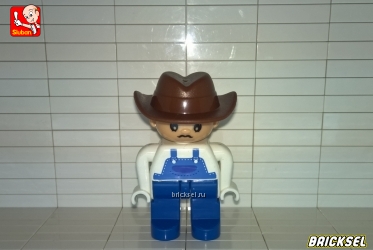 Фермер-ковбой в коричневой шляпе, белой рубашке и синем комбинезоне